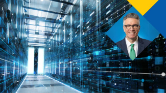 Professor Felipe Csaszar against a background of an AI server room